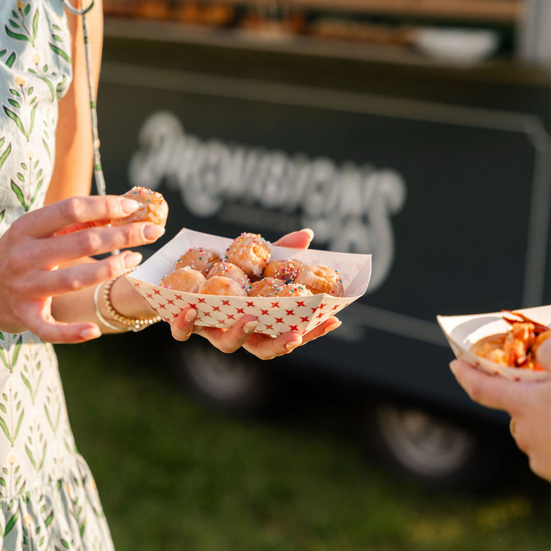 A Provisions food truck in a wide open field under a big sky