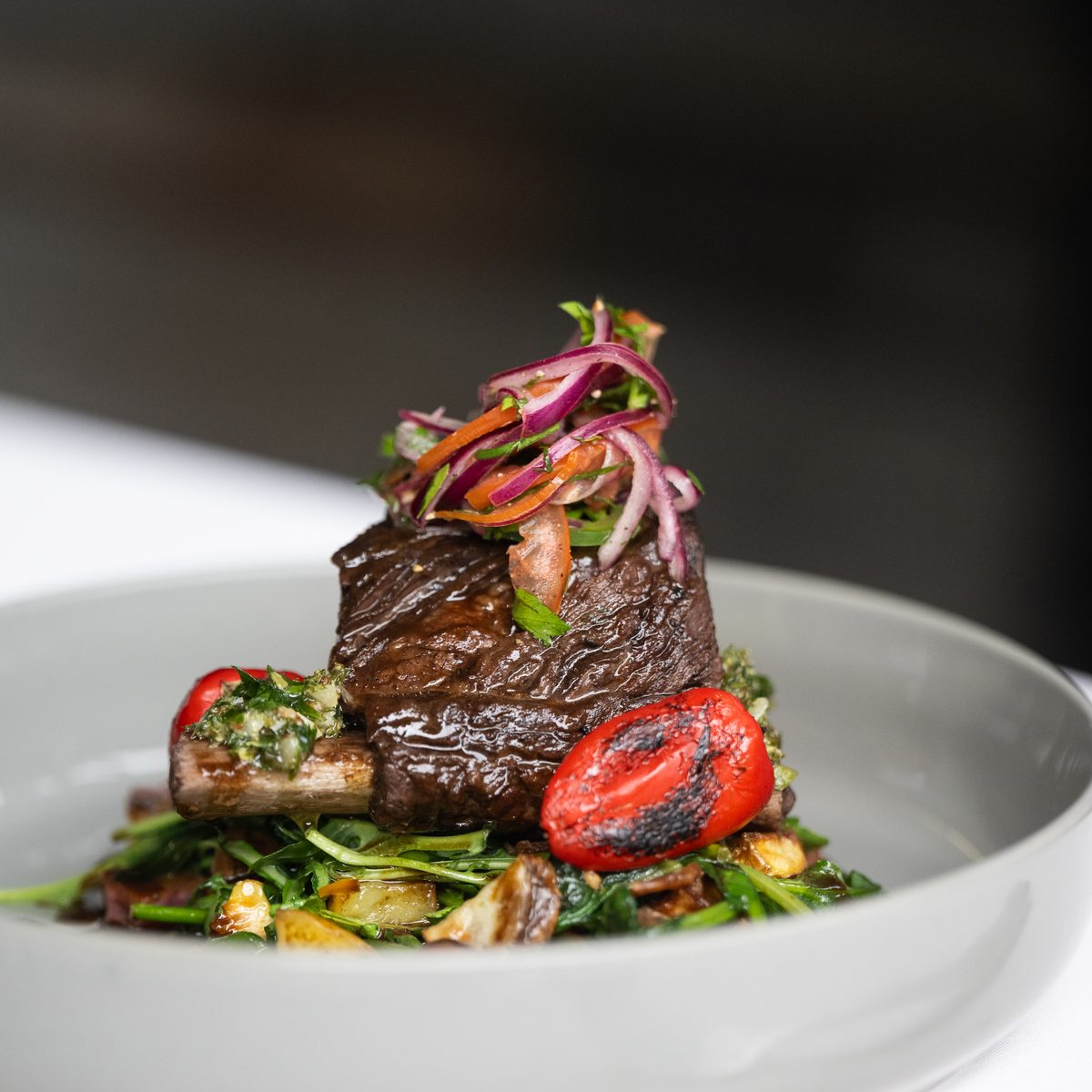 Braised short rib with charred peppers and greens for an après ski private chef dinner in Jackson Hole