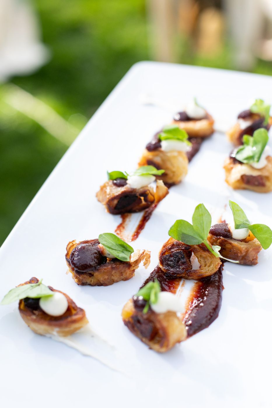 Appetizers lined up on a white table