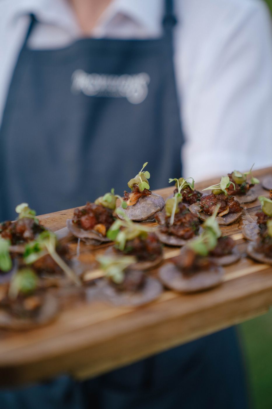 Server holding a board of crostini