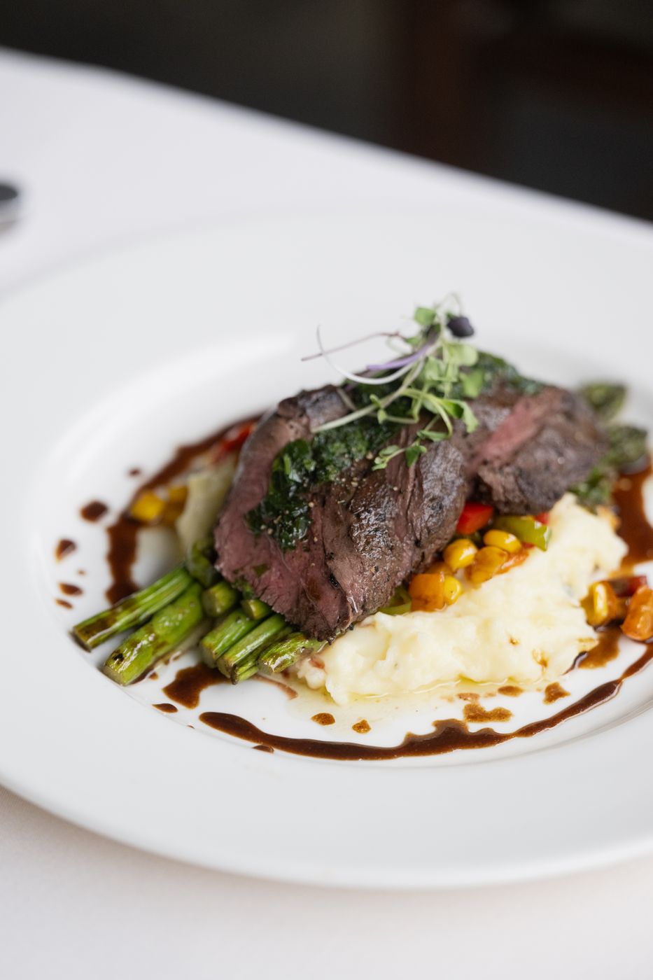 Plated steak with whipped potatoes and asparagus