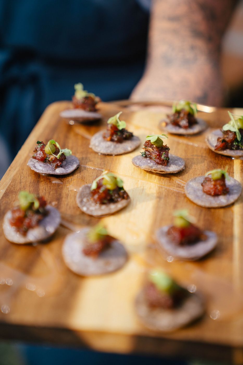 Wooden board of tostada bites