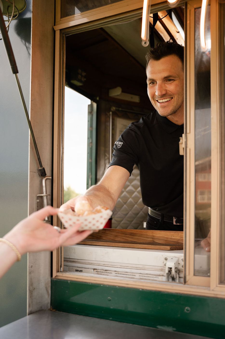 Chef handing food out the truck window