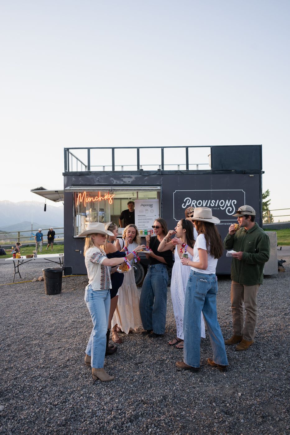 Crowd gathered at the food truck at dusk