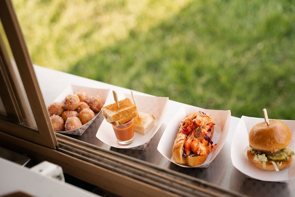 Food truck bites lined up in paper boats