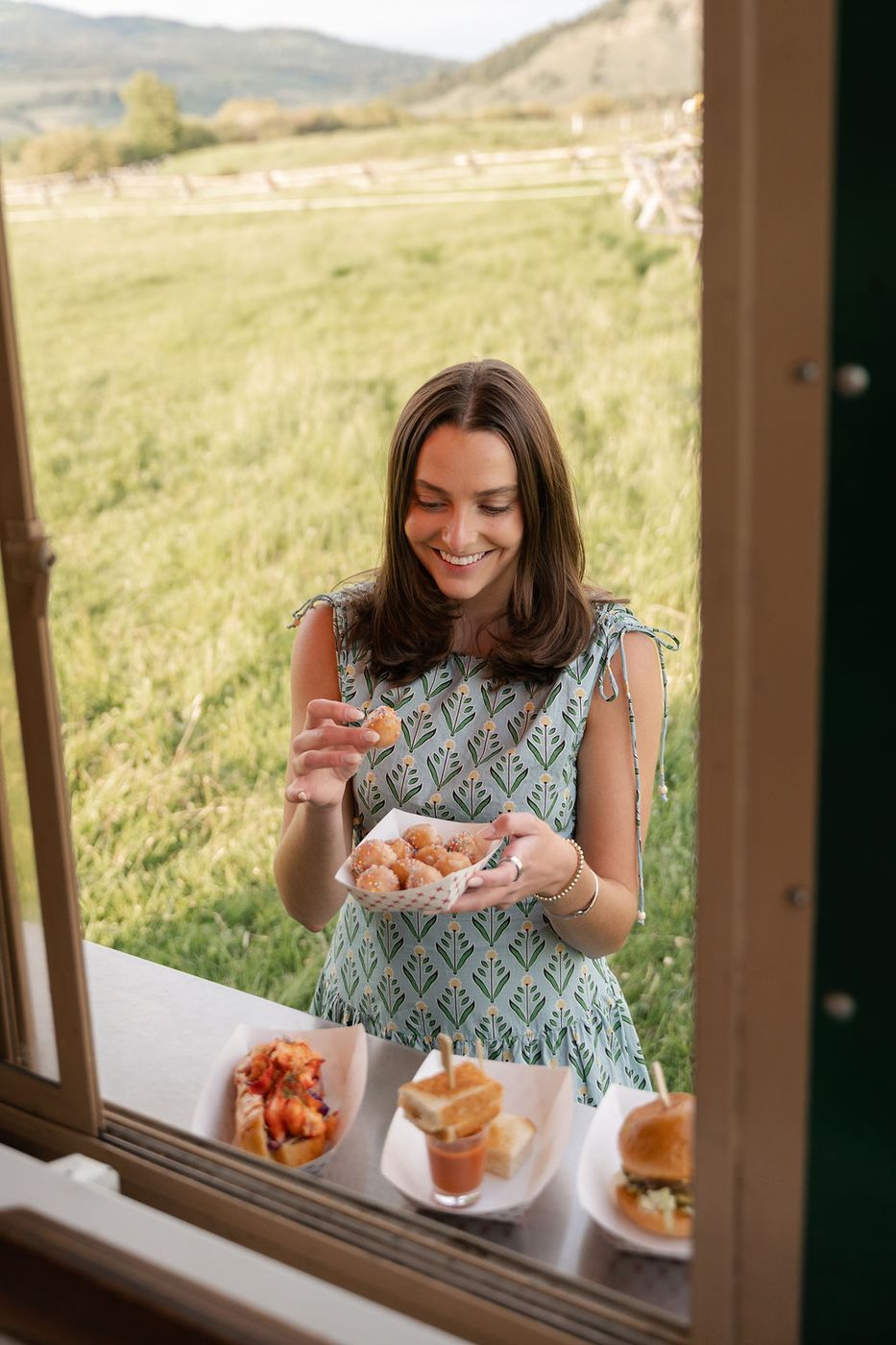 Guest picking up food at the truck window