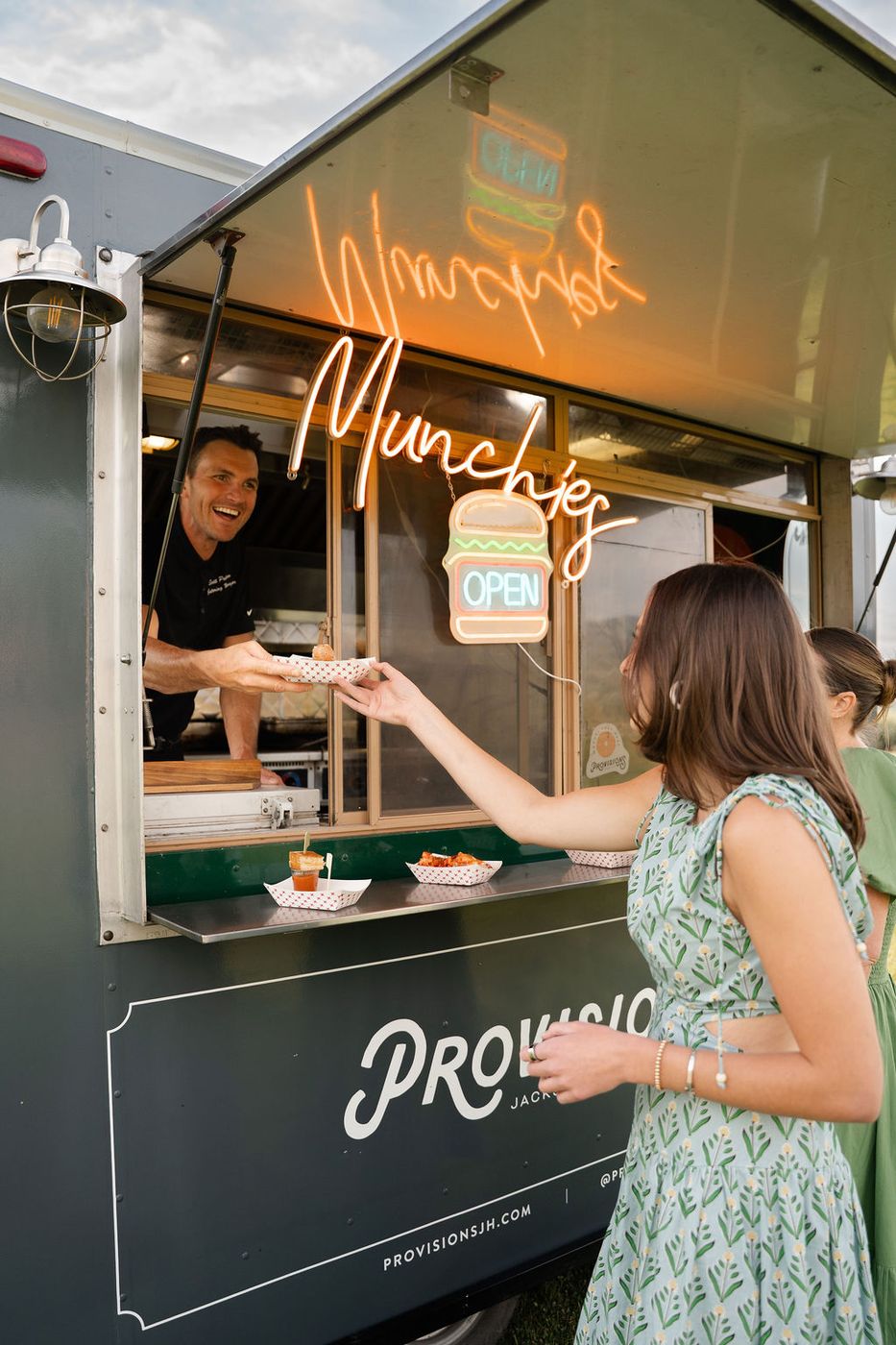 Guest getting food from the Provisions truck