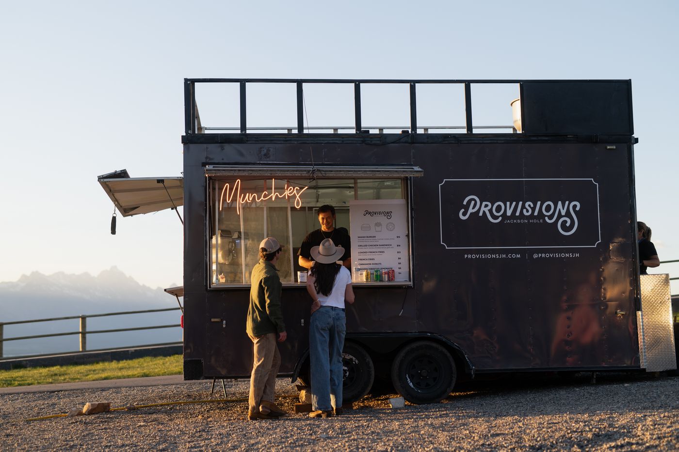 Guests ordering at the Provisions Munchies food truck at sunset in Jackson Hole