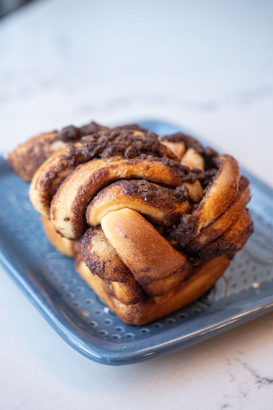 Chocolate babka on a blue plate
