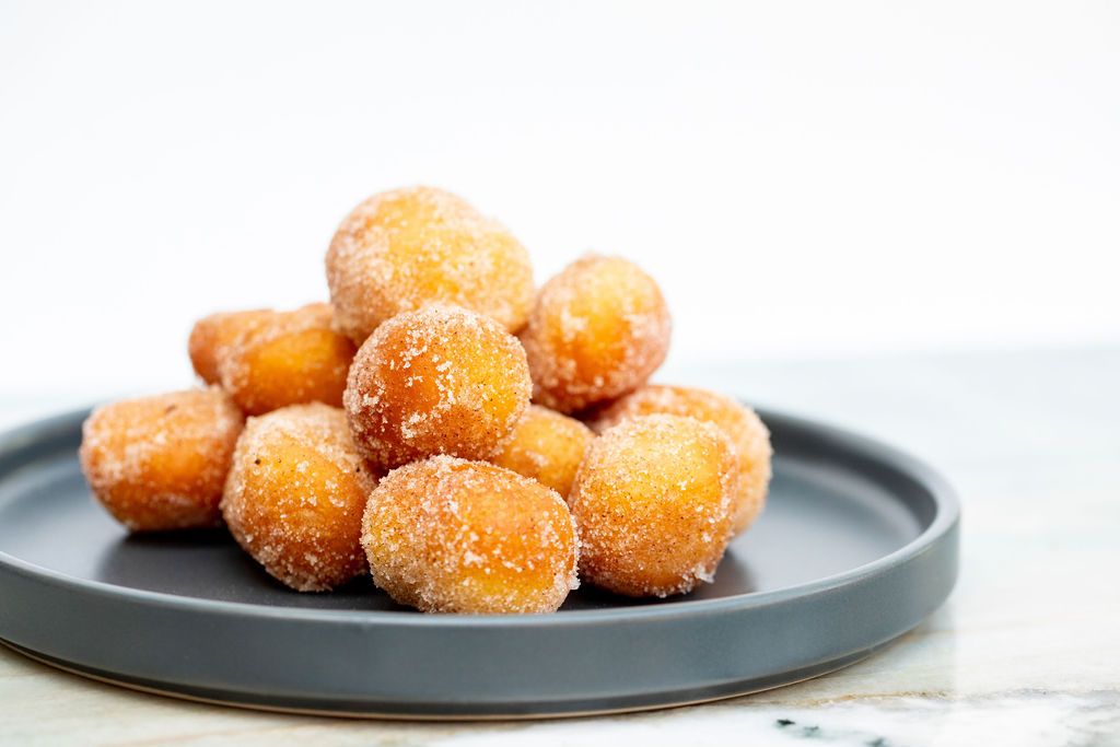 Plate of sugared donut holes