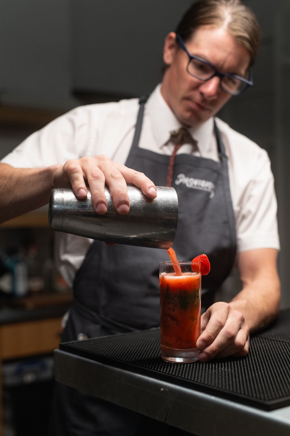 Bartender pouring a cocktail