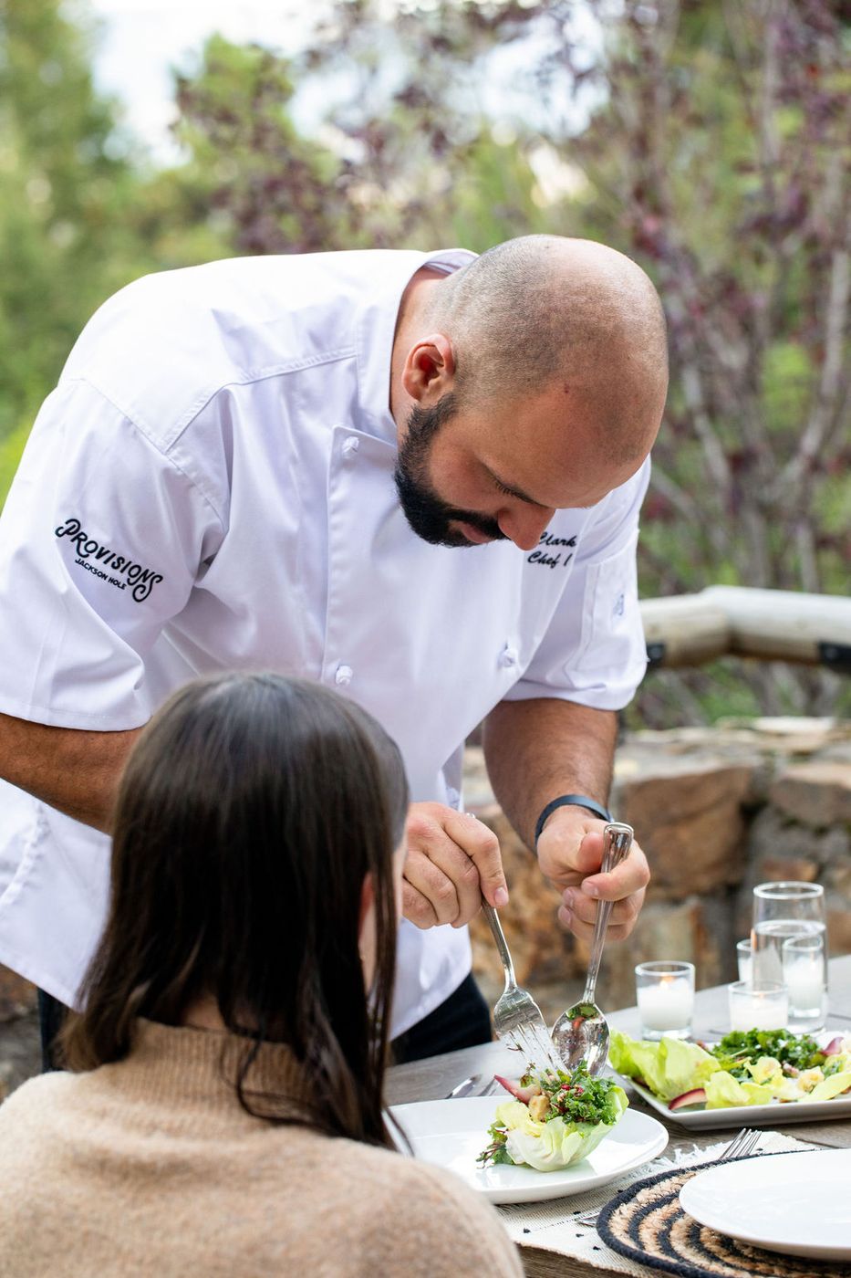 Chef plating at the table for guests