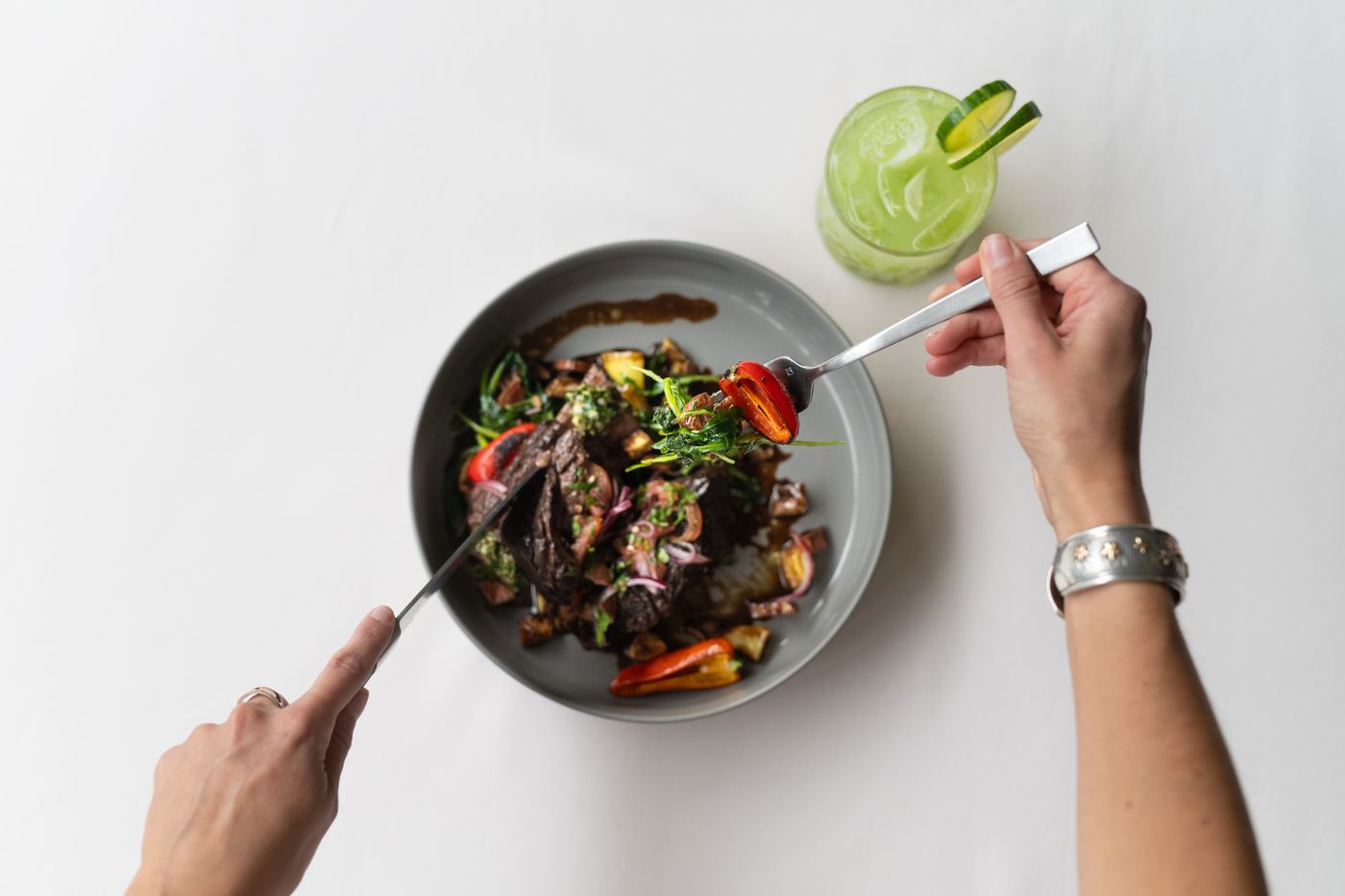 Guest cutting into braised short rib