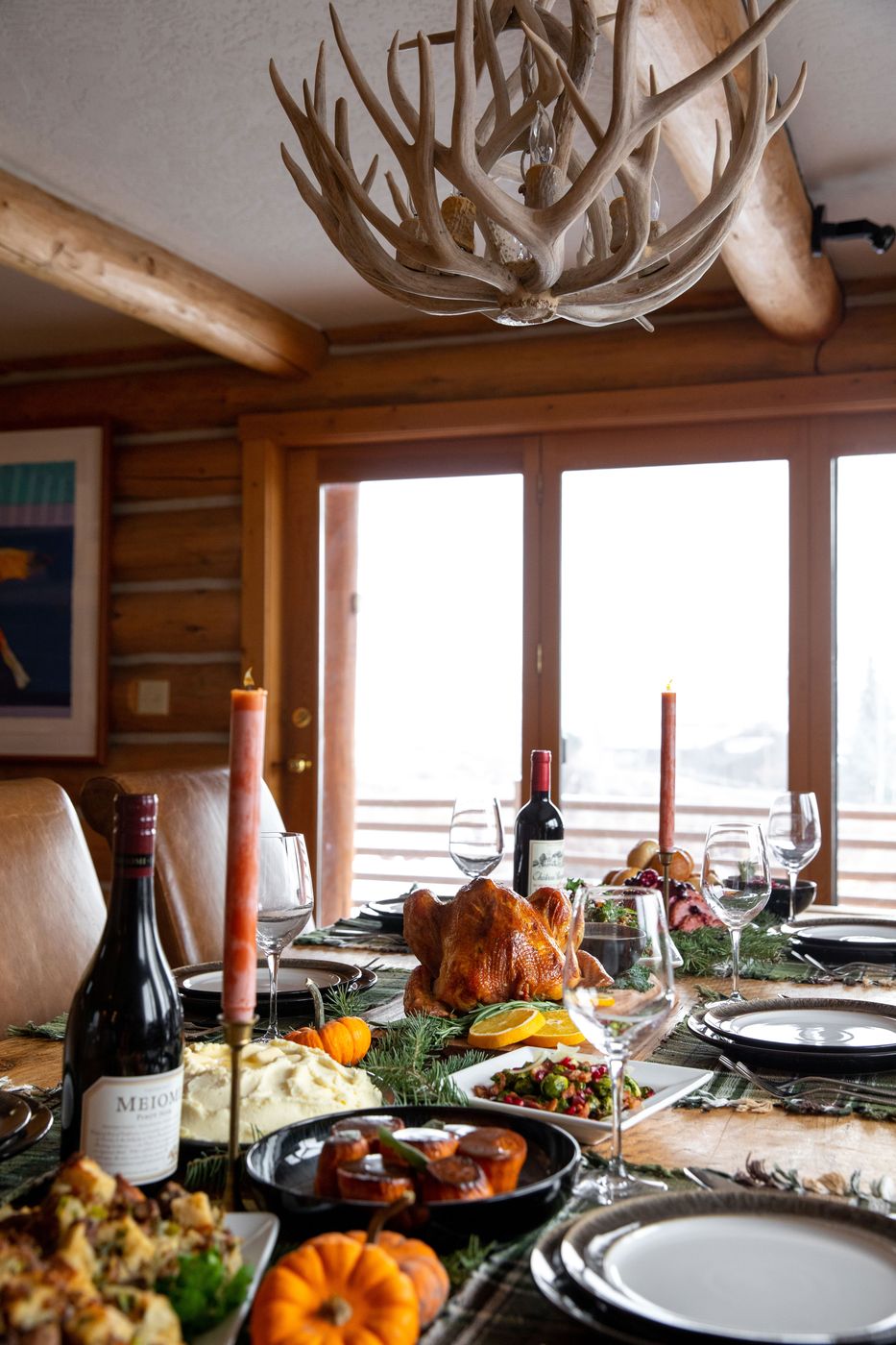Holiday dinner table set in a log cabin