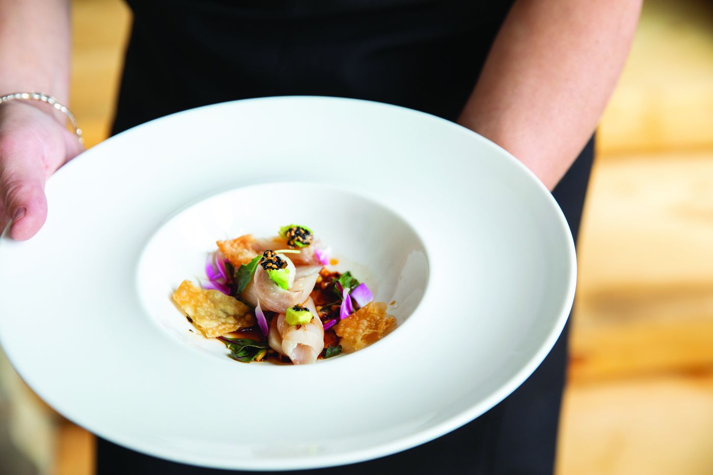 Plated course being served at a private dinner