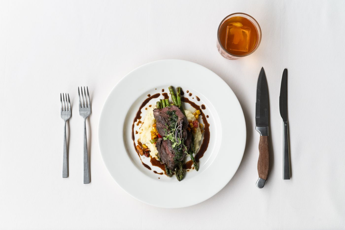 Plated steak at a place setting
