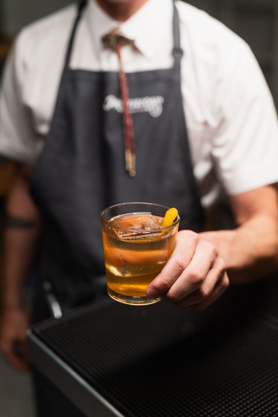 Server holding an old fashioned